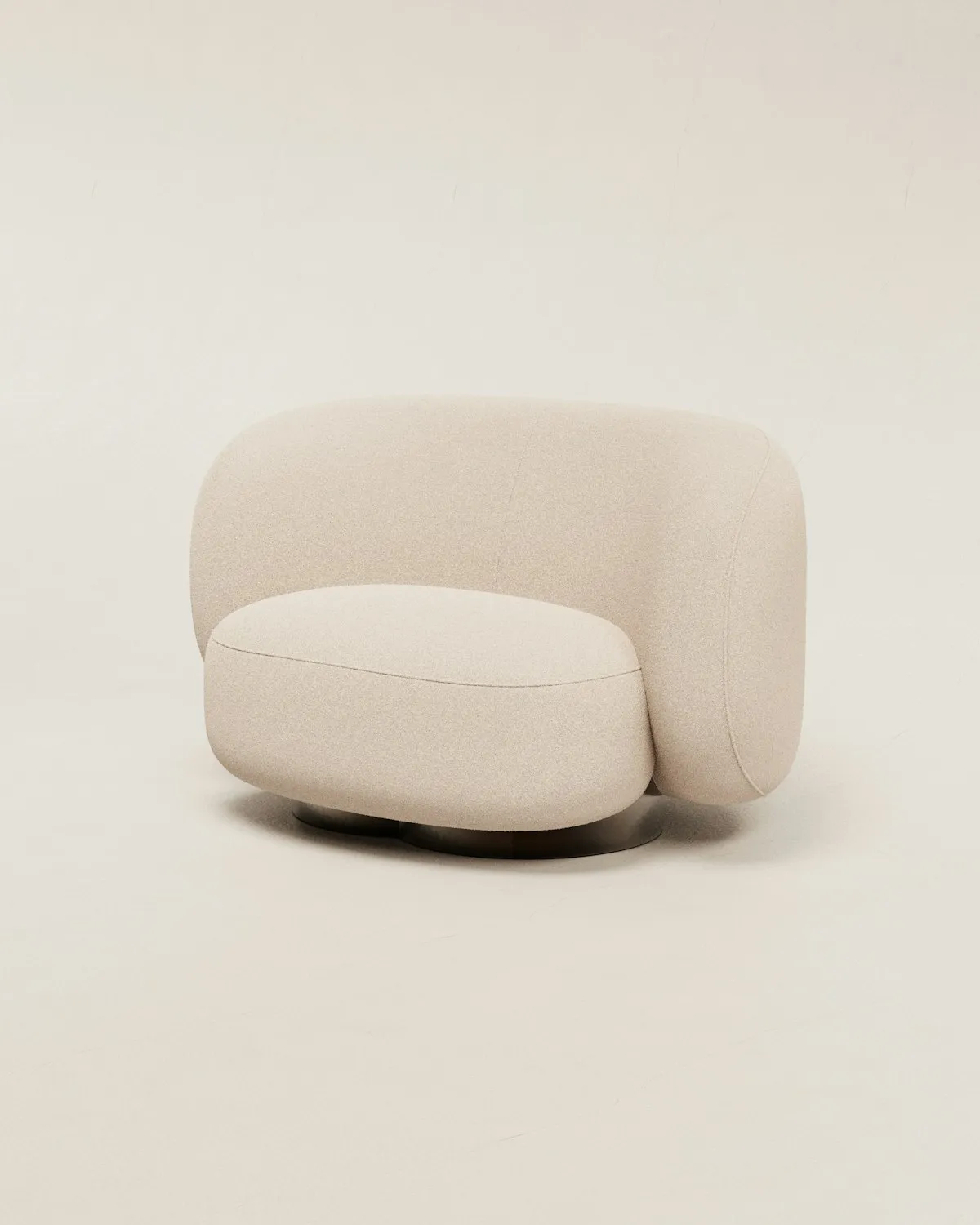 Rounded bouclé swivel lounge chair with a wraparound backrest and low seat on a dark disc base, against a plain cream background.